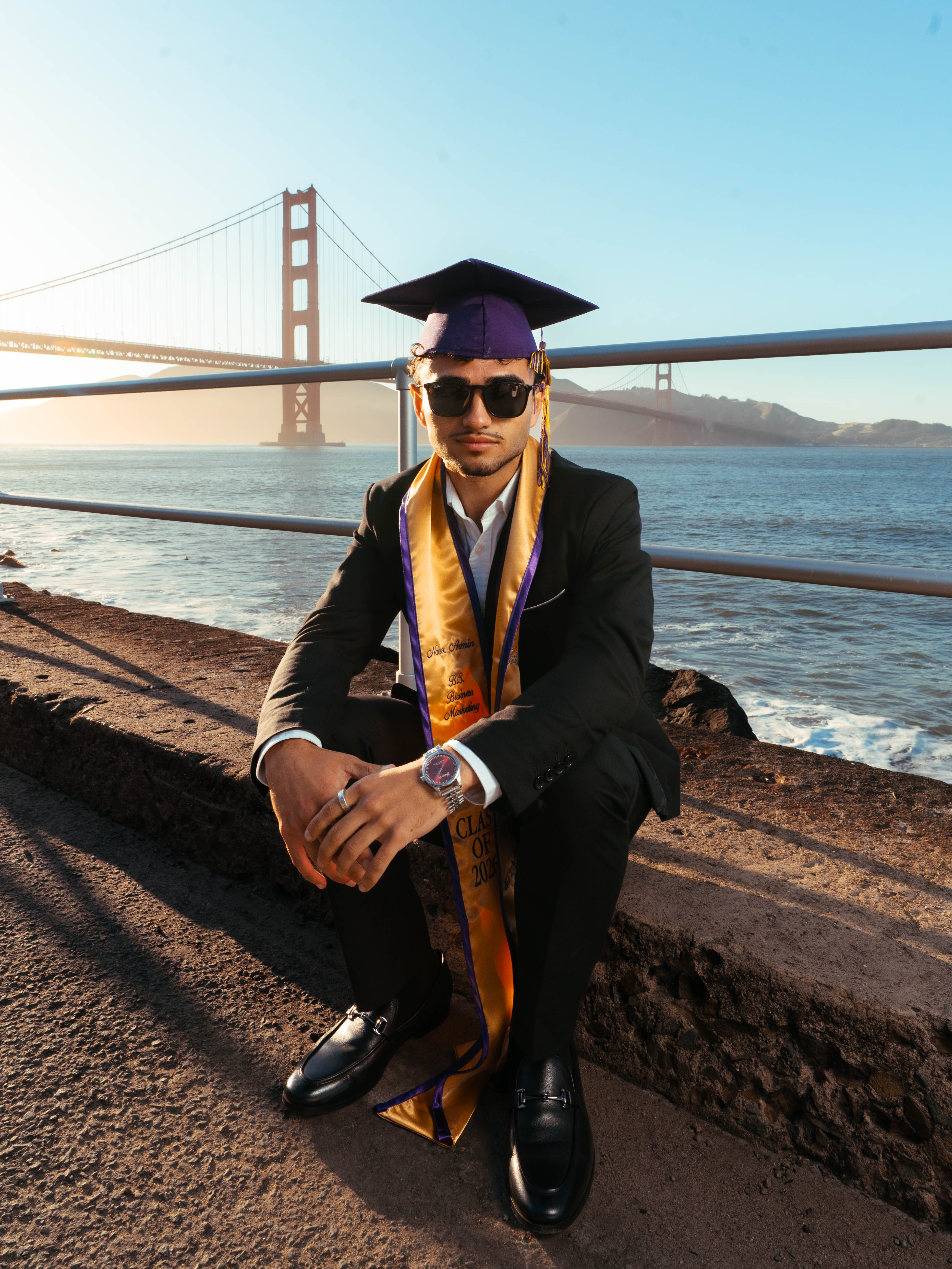 SJSU graduate portrait with the San Francisco Bay skyline in the background